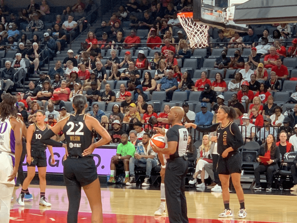 Players on the Las Vegas Aces and Los Angeles Sparks line up for a free throw after a foul.