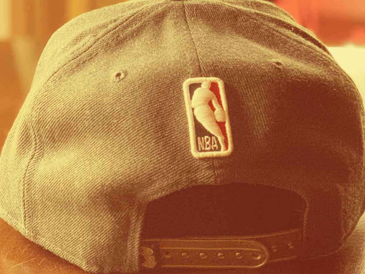 Photo of the back of a hat with the NBA logo patch.