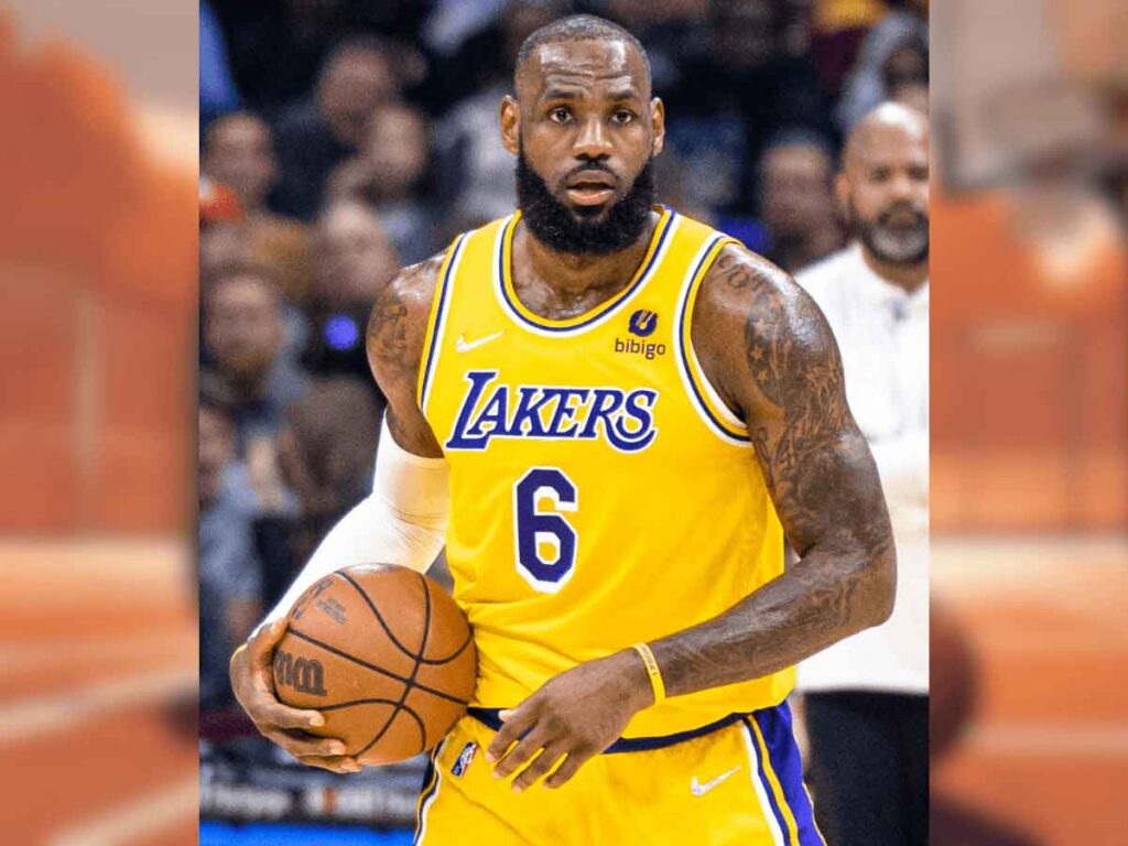 A photo of LeBron James, the oldest NBA player, holding a basketball.