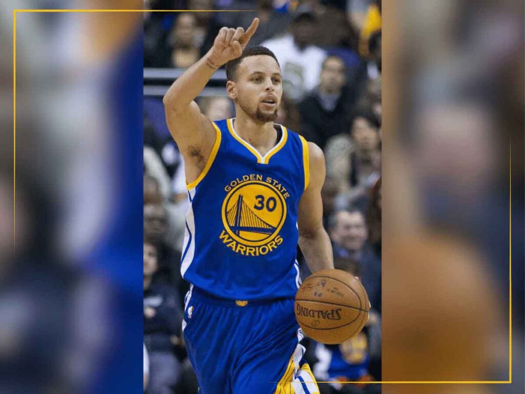 Stephen Curry, NBA point guard with the Golden State Warriors calls a play during a game.
