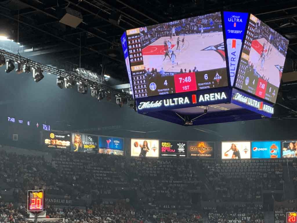 Photo of the clock above half-court during a WNBA game at Michelob ULTRA Arena in Las Vegas.