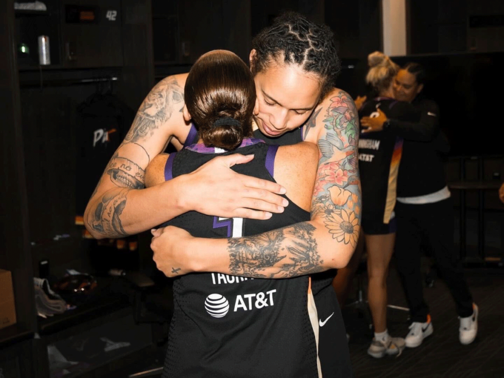 Brittney Griner embraces Diana Taurasi in a hug.