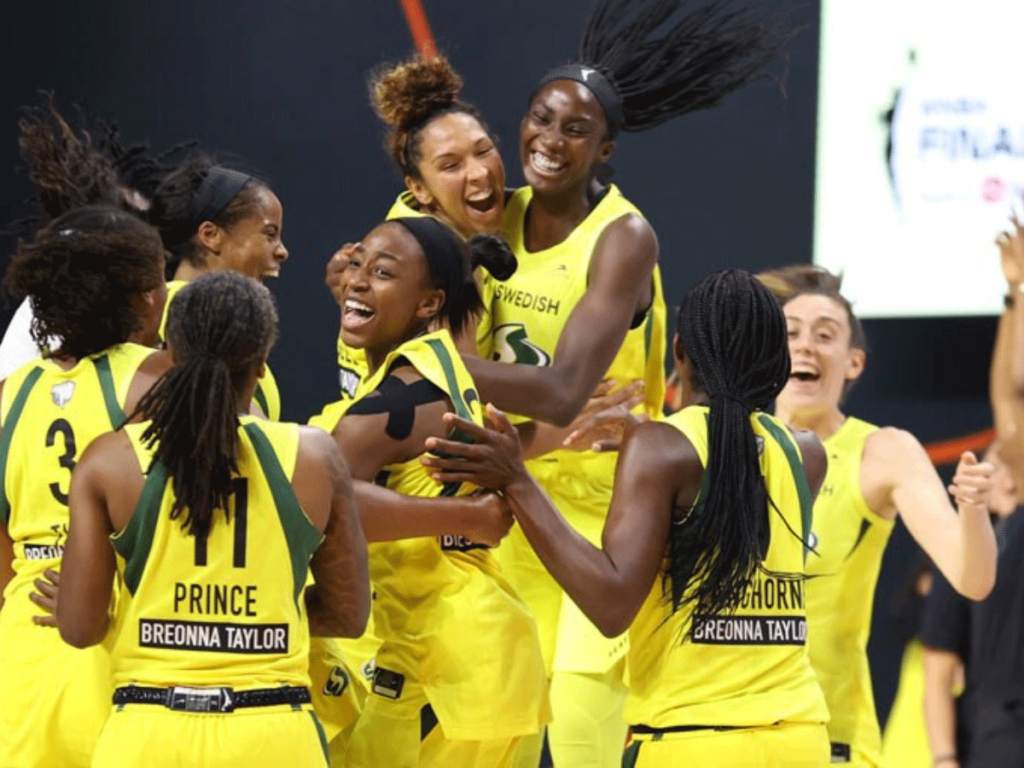 The Seattle Storm team celebrates after clinching the 2020 WNBA Championship.